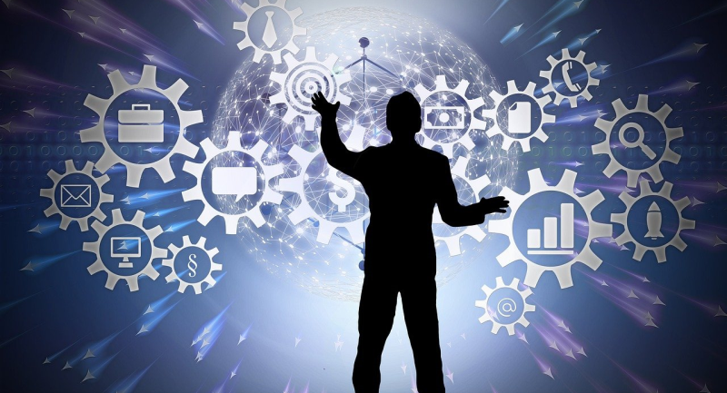 An illustration of cogs and networks on a screen, being touched or manipulated by a human figure. 